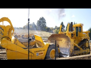 1980s Caterpillar D10 Bulldozer pushing a Cat 630B Scraper in Wanaka