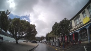 Driving Beach Road in Akaroa next to the harbour | Canterbury | New Zealand | 4K