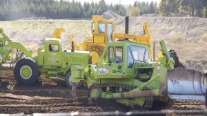 Terex and Euclid Earthmovers Working With a Caterpillar CAT D10 Bulldozer
