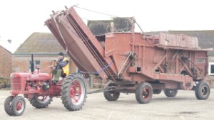 1941 McCormick Deering Farmall H Tractor Towing a Threshing Mill