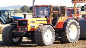 SAME Laser 150 Tractor Pulling a 2023 JCB Fastrac 4220 Tractor